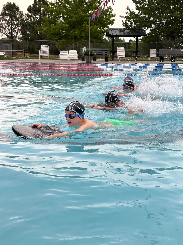 Swimmer practicing kicking technique outdoors